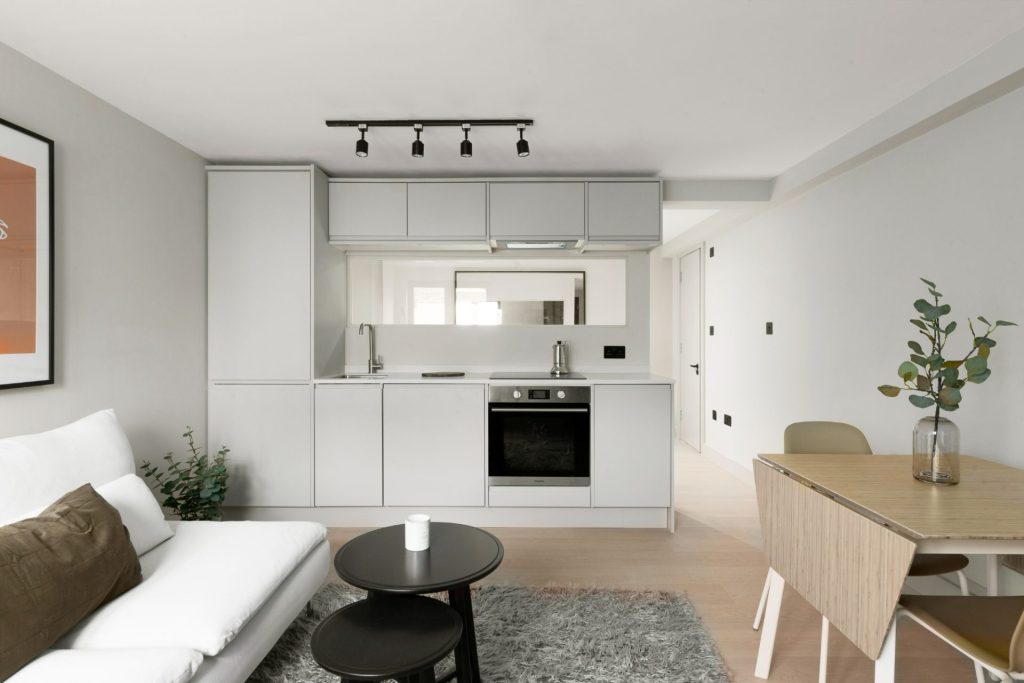 Conversion of a 2-storey commercial workshop building into 7 residential units, delivered from strip-out and structural works through to completion.
