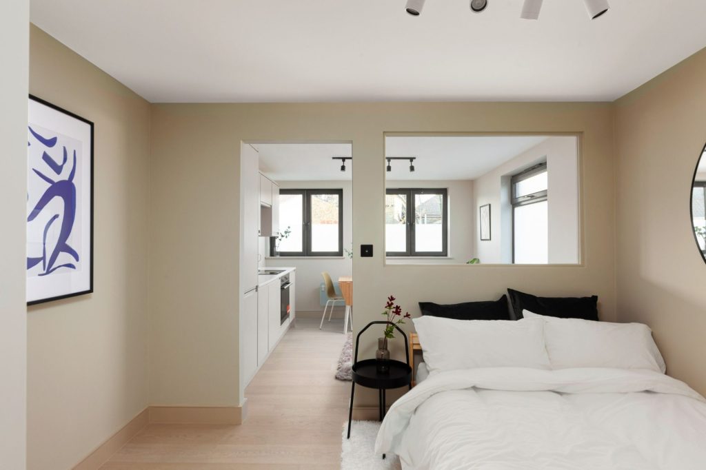 Conversion of a 2-storey commercial workshop building into 7 residential units, delivered from strip-out and structural works through to completion.
