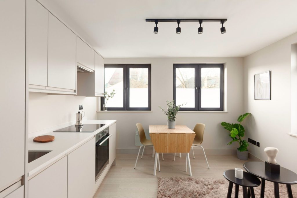 Conversion of a 2-storey commercial workshop building into 7 residential units, delivered from strip-out and structural works through to completion.
