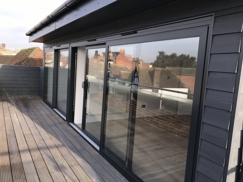 Conversion of existing office space into 7 residential units, including the addition of a new penthouse at roof level.